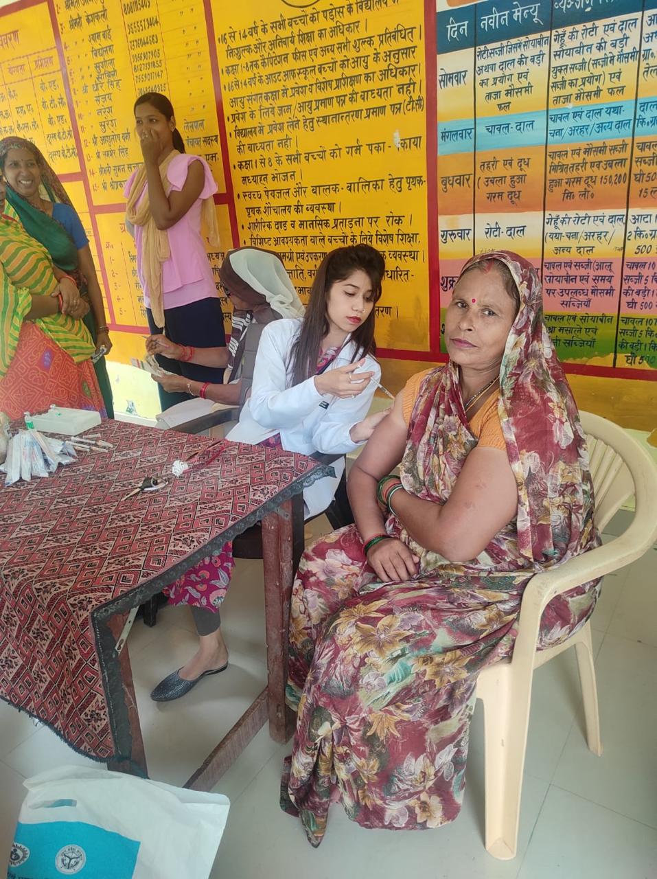 Nurse Samya administering routine vaccines to children in community health drive