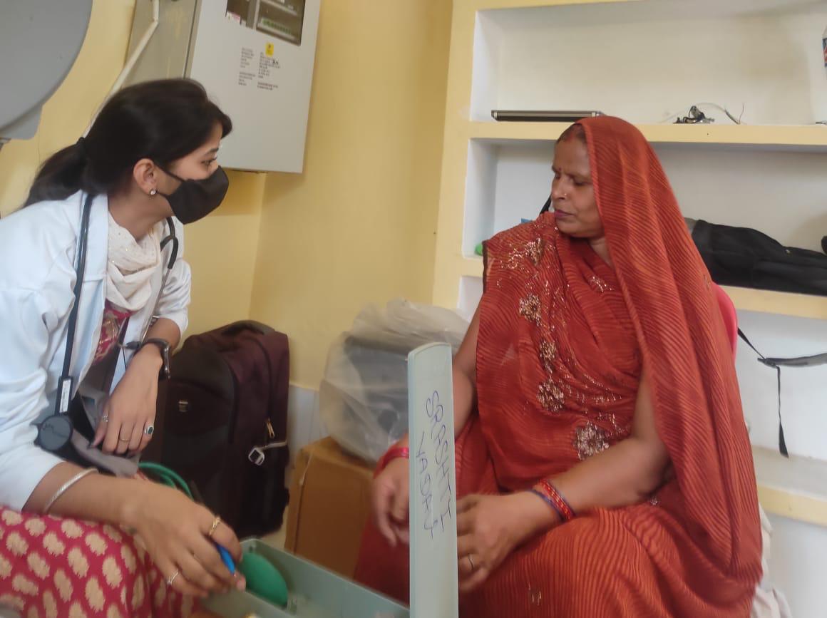 Nurse Samya educating village patients on preventive health